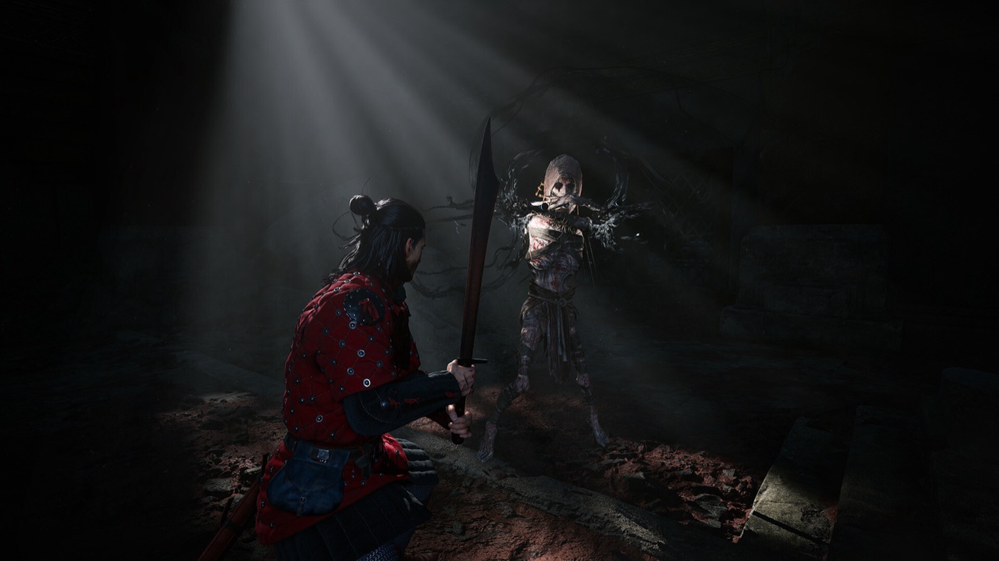 Coen fights a large enemy in a dark medieval interior