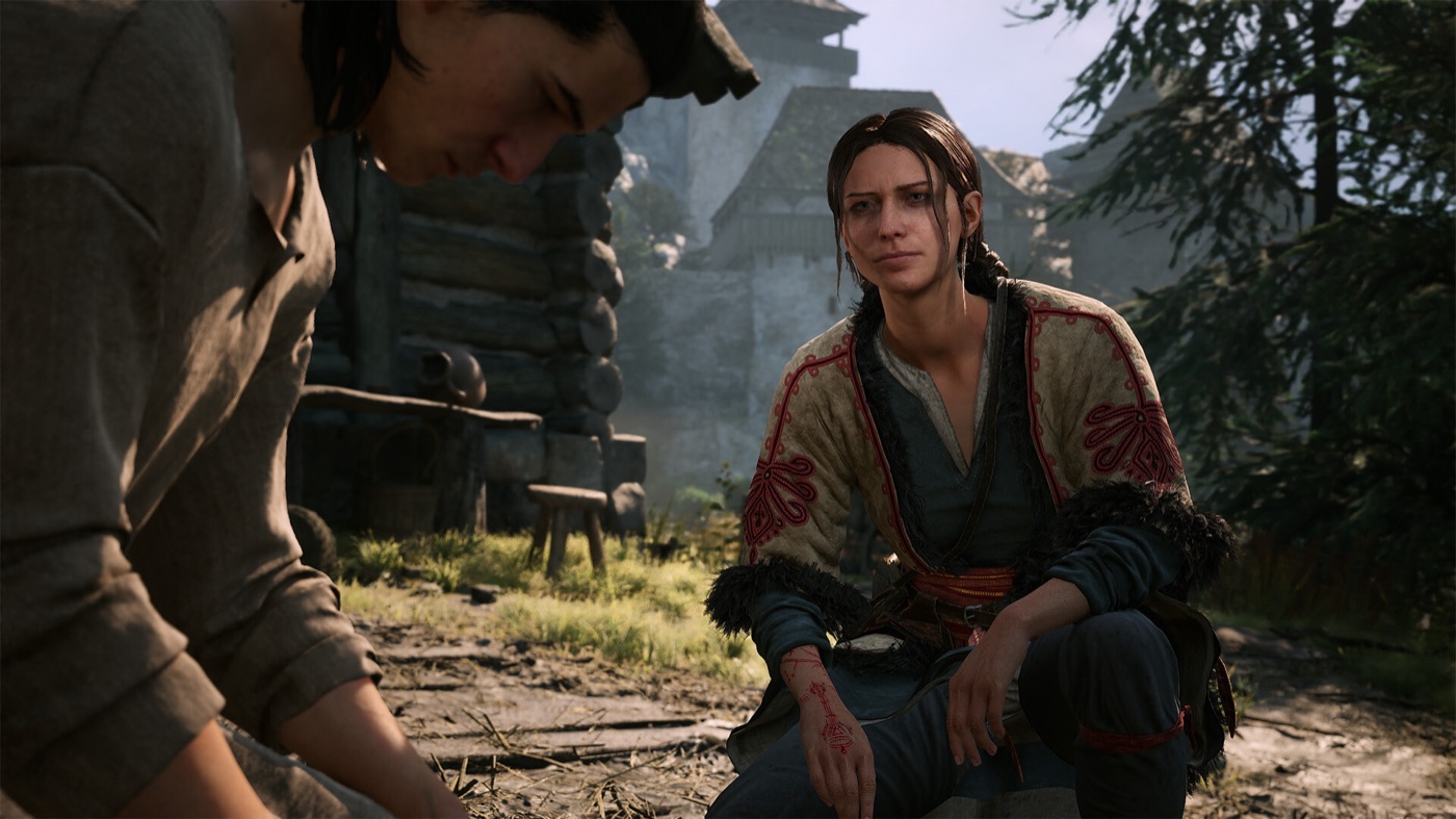 A conversation beside a medieval settlement