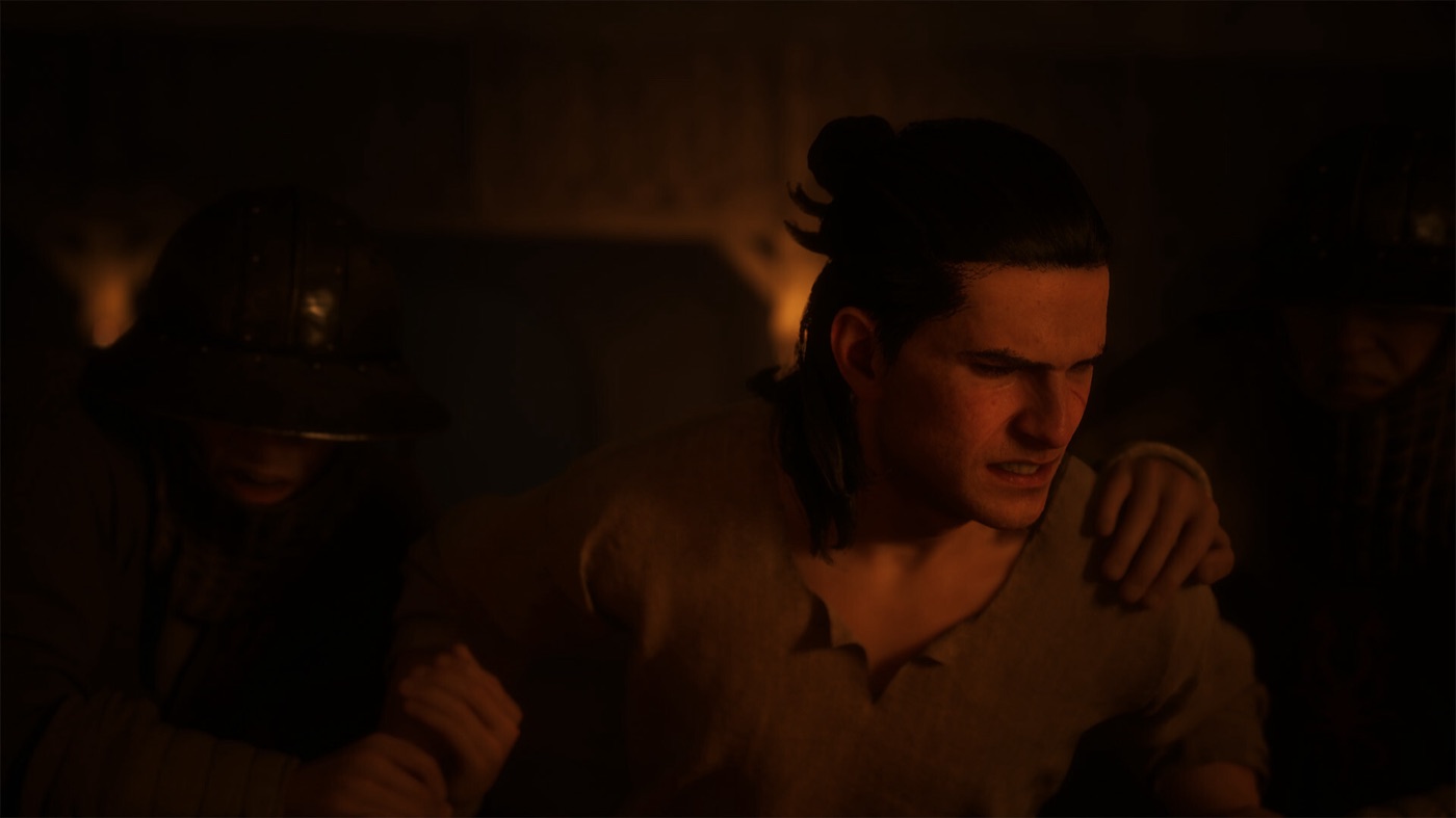 A dark-haired character stands in a warm red-brown room